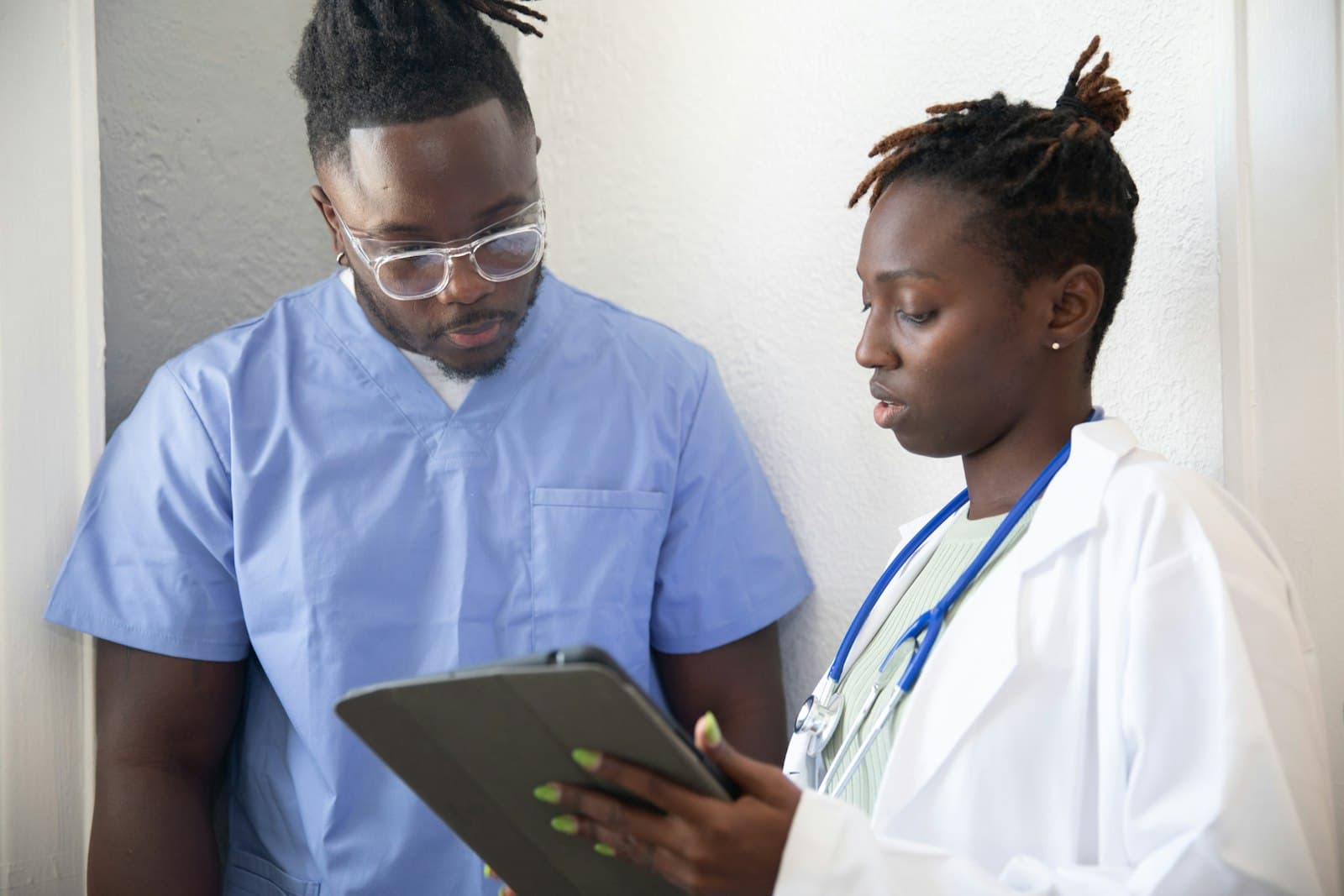 A clinician reviewing records on a tablet